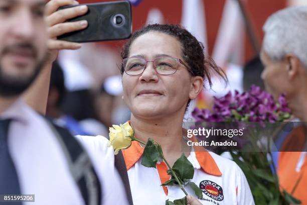 Woman takes a photo during a demonstration organised by the Central of Brazil's Workers and the other trade union centrals with demonstrators...