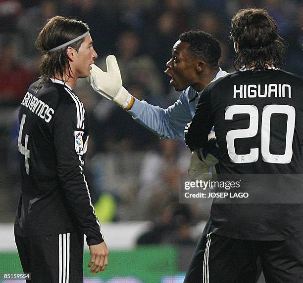 Real Madrid's Defender Sergio Ramos Garcia argues with Espanyol goalkeeper Carlos Kameni during their League football match at the Olympic Stadium in...
