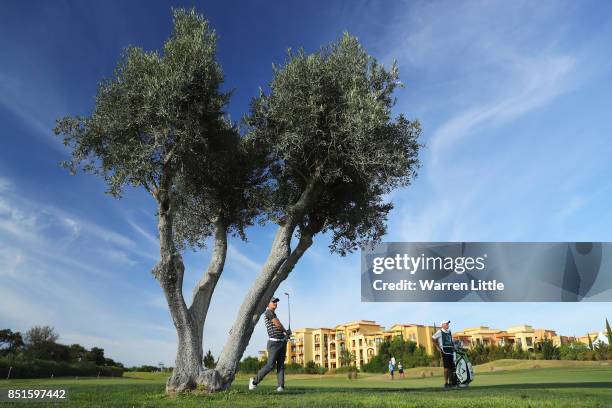 Chris Paisley of England plays his second shot on the 9th hole during day two of the Portugal Masters at Dom Pedro Victoria Golf Club on September...