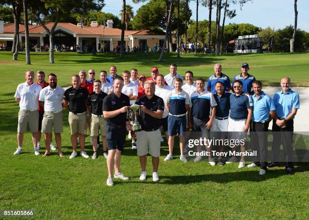 Steve Parry and Andrew Picton of Hart Common Golf Club winners of the Lombard Trophy Grand Final pose with all the competitors during The Lombard...