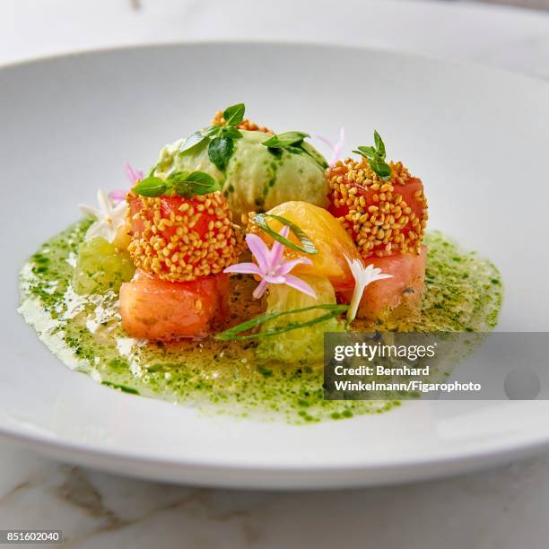 Tomatoes and cream of avocado from the Brasserie dAumont at the Crillon Hotel are photographed for Madame Figaro on August 28, 2017 in Paris, France....