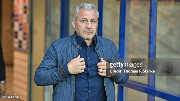 Head coach Pavel Dotchev of Rostock enters the pitch prior to the 3. Liga match between SC Paderborn 07 and F.C. Hansa Rostock at Benteler Arena on...