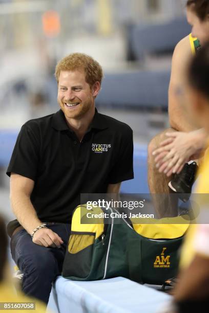 Prince Harry smiles as he speaks to athletes during a pre Invictus Games training session at Pan Am Sports Centre on September 22, 2017 in Toronto,...