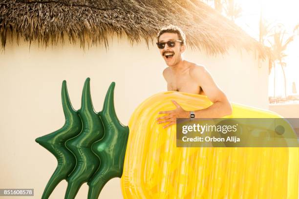 tourist at the beach - pool raft stock pictures, royalty-free photos & images