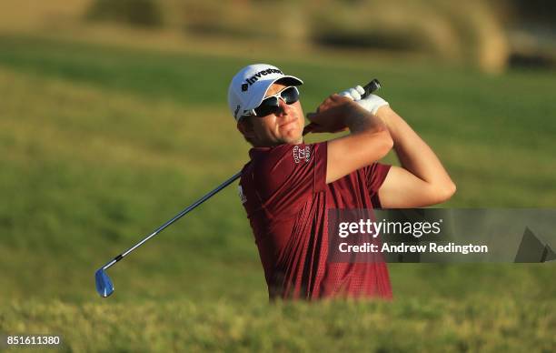 Dean Burmester of South Africa plays his second shot on the 18th hole during day two of the Portugal Masters at Dom Pedro Victoria Golf Club on...