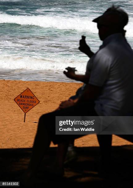 Sign is seen at the closed Avalon Beach after a shark attack on a surfer on March 1, 2009 in Sydney, Australia. The shark attack was the third in as...