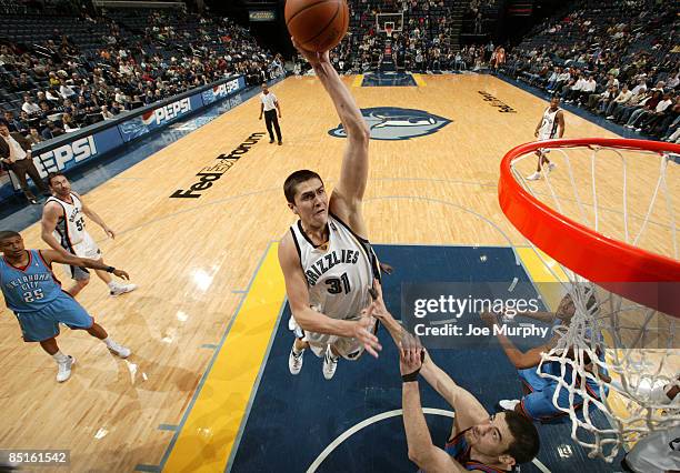 Darko Milicic of the Memphis Grizzlies dunks in a game against the Oklahoma City Thunder on February 28, 2009 at FedExForum in Memphis, Tennessee....