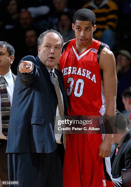 Head coach Doc Sadler of the Nebraska Cornhuskers points out some instructions to guard Toney McCray during a game against the Kansas State Wildcats...