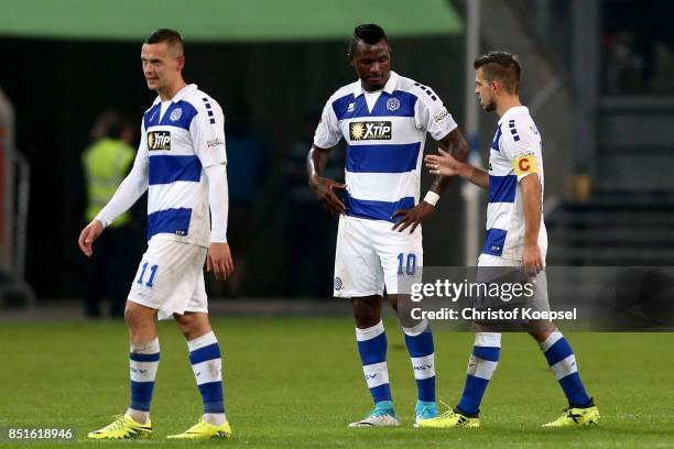 Stanislav Illjutcenko, Kingsley Onuegbu and Kevin Wolze of Duisburg look dejected after the Second Bundesliga match between MSV Duisburg and Holstein...