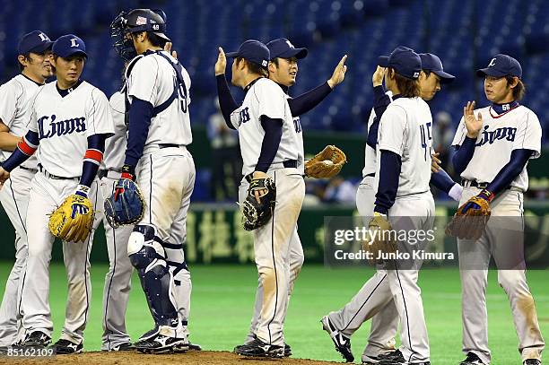 Players of Saitama Seibu Lions celebrate victory after a friendly match between China and Saitama Seibu Lions at Tokyo Dome on March 1, 2009 in...