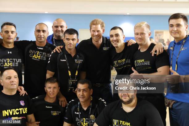 Prince Harry poses with Romania's Team athletes during a pre Invictus Games training session at Pan Am Sports Centre on September 22, 2017 in...
