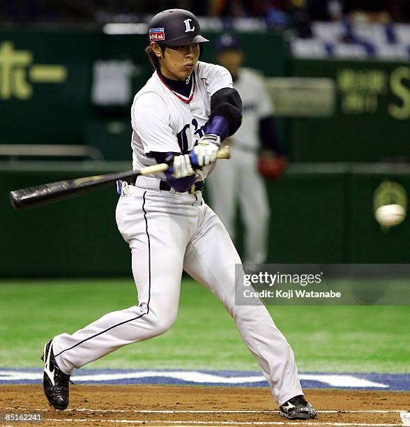 Infielder Haruki Kurose of Saitama Seibu Lions bats during a friendly match between China and Saitama Seibu Lions at Tokyo Dome on March 1, 2009 in...