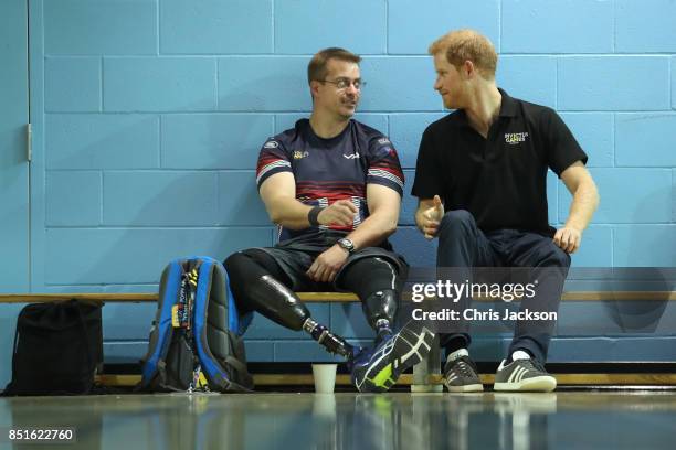 Prince Harry sits with Charlie Walker Of the UK armed forces team during a pre Invictus Games training session at Pan Am Sports Centre on September...