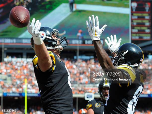 Tight end Jesse James and wide receiver Antonio Brown of the Pittsburgh Steelers celebrate a touchdown by James in the second quarter of a game on...
