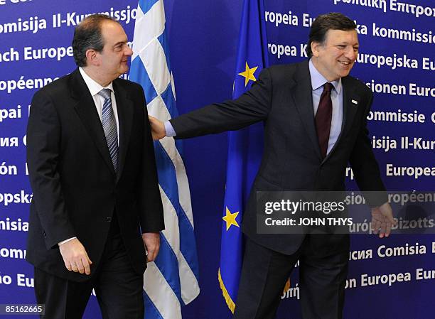 European Commission President Jose Manuel Barroso welcomes Greek Prime minister Konstandinos Karamanlis prior to their economic summit meeting, on...