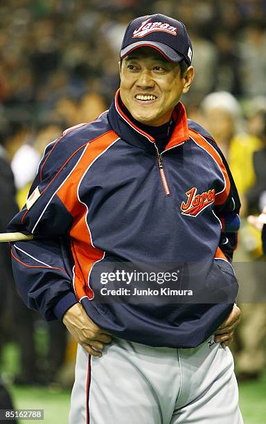 Head Coach Tatsunori Hara of Japan looks on during a practice session before a friendly match between Japan and Yomiuri Giants at Tokyo Dome on March...