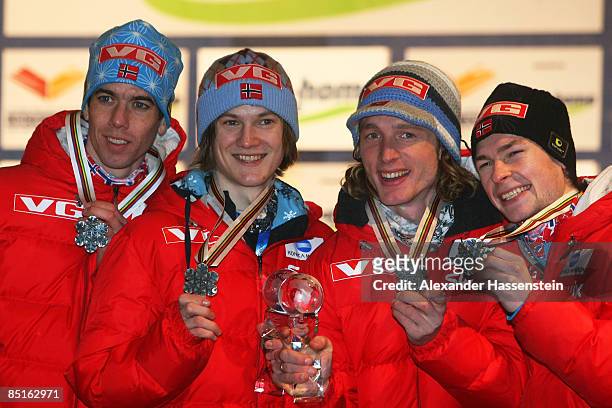 The Norway team pose with the Silver medals won during the Men's Team Ski Jumping 134M Hill competition at FIS Nordic World Ski Championships 2009 on...
