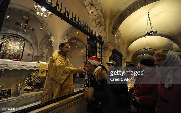 Christian Orthodox Bishop Egorievsk Mark celebrates mass inside the crypt of Saint Nicholas church on March 1, 2009 in Bari. Italian President...