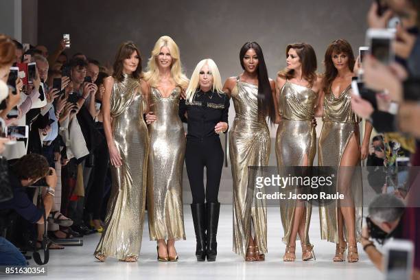 Carla Bruni, Claudia Schiffer, Naomi Campbell, Cindy Crawford, Helena Christensen and Donatella Versace walk the runway at the Versace show during...