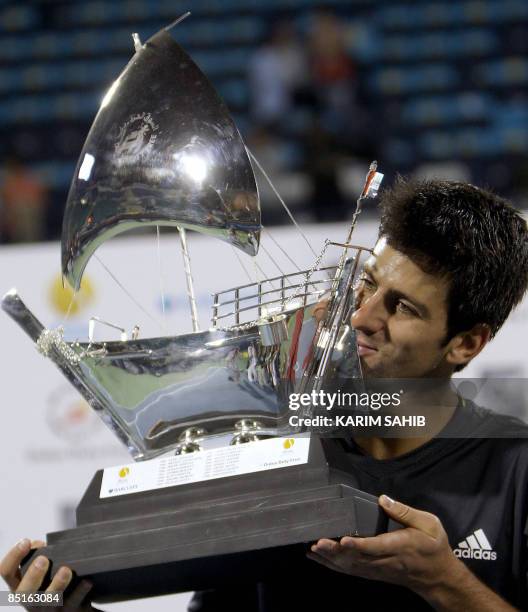 Serbia's Novak Djokovic kisses his trophy after winning the ATP Dubai tennis championships in the Gulf emirate on February 28, 2009. Djokovic closed...