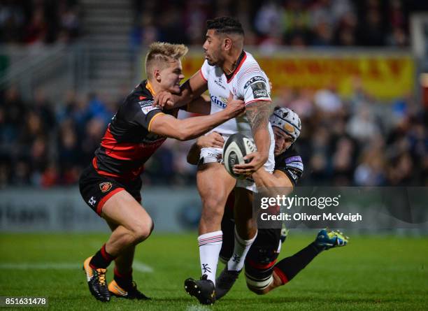 Belfast, United Kingdom - 22 September 2017; Charles Piutau of Ulster is tackled by George Gasson and Ollie Griffiths of Dragons during the Guinness...