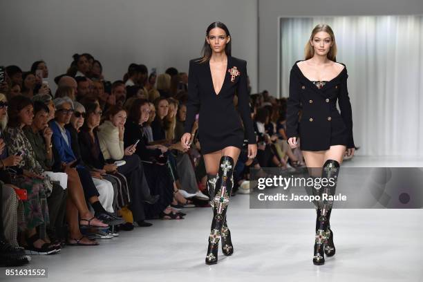 Gigi Hadid and Binx Walton walk the runway at the Versace show during Milan Fashion Week Spring/Summer 2018 on September 22, 2017 in Milan, Italy.