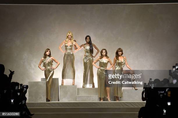Supermodels Carla Bruni, Claudia Schiffer, Naomi Campbell, Cindy Crawford and Helena Christensen line up for the runway finale at the Versace Spring...