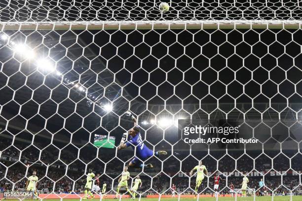 Angers' French goalkeeper Alexandre Letellier stops the ball during the French L1 football match between Nice and Angers at Allianz Riviera Stadium...