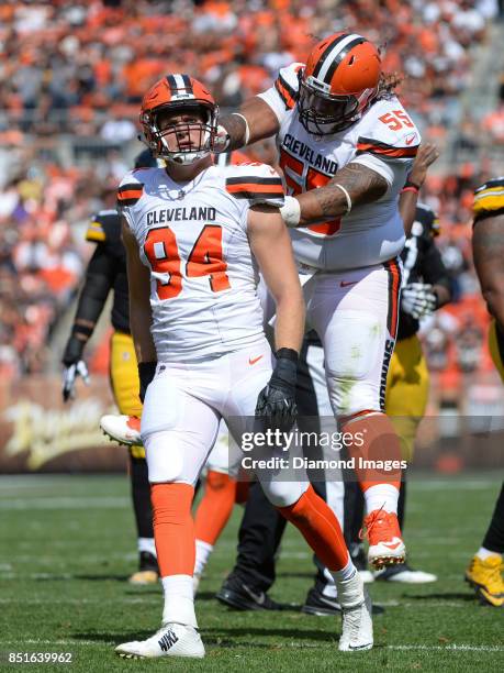 Defensive lineman Carl Nassib and defensive tackle Danny Shelton of the Cleveland Browns celebrate a sack by Nassib in the third quarter of a game on...