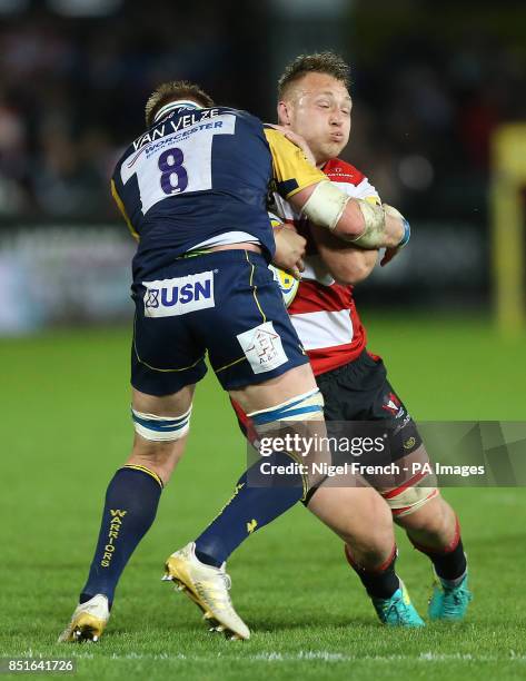 Gloucester's Ruan Ackermann is tackled by Worcester's GJ van Velze during the Aviva Premiership match at the Kingsholm Stadium, Gloucester.