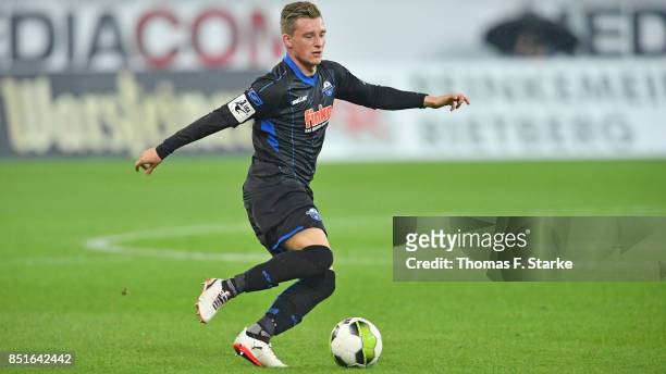 Marlon Ritter of Paderborn runs with the ball during the 3. Liga match between SC Paderborn 07 and F.C. Hansa Rostock at Benteler Arena on September...