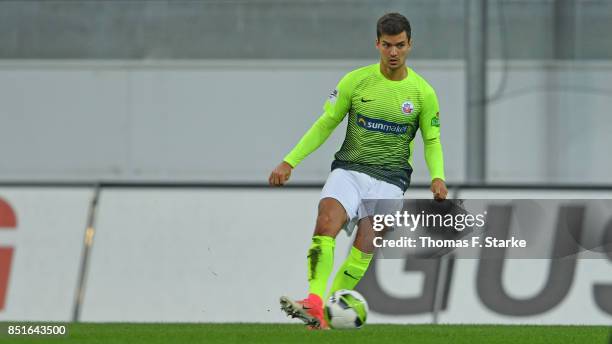 Julian Riedel of Rostock runs with the ball during the 3. Liga match between SC Paderborn 07 and F.C. Hansa Rostock at Benteler Arena on September...
