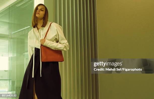 Model Kersti Pohlak poses at a fashion shoot for Madame Figaro on July 22, 2017 in Paris, France. Dress, belt and bag , earring . PUBLISHED IMAGE....