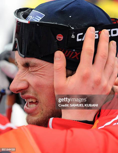 Norway's Petter Northug catches his breath after winning the men's 50km Mass Start Free event and his third gold medal of the Nordic Skiing World...