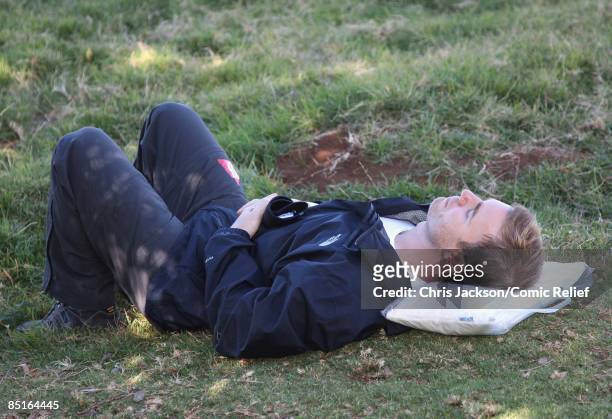 Gary Barlow takes a rest during trekking on the on the first day of The BT Red Nose Climb of Kilimanjaro on March 1, 2009 in Arusha, Tanzania....