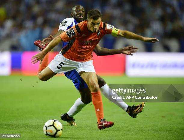 Porto's Malian forward Moussa Marega vies with Portimonense's defender Ricardo Pessoa during the Portuguese league football match FC Porto vs...