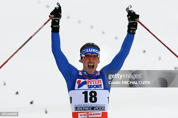 Maxim Vylegzhanin of Russia celebrates his second place while he crosses a finnish line during the Men's 50Km Mass Start Free event of the Nordic...