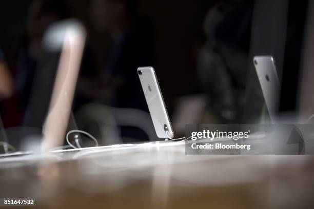 An Apple Inc. IPhone 8 smartphone stands on display during the sales launch of the Apple Inc. IPhone 8 smartphone, Apple watch series 3 device, and...