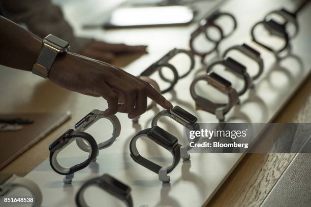 Customer views Apple Inc. Watch series 3 devices on display during the sales launch of the Apple Inc. IPhone 8 smartphone, Apple watch series 3...