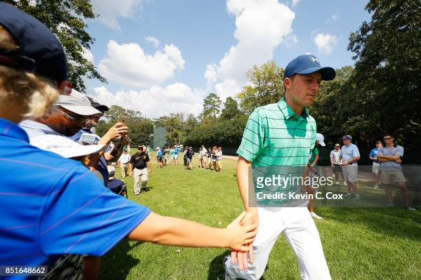 Jordan Spieth of the United States greets fans during the second round of the TOUR Championship at East Lake Golf Club on September 22, 2017 in...