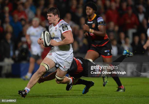 Belfast, United Kingdom - 22 September 2017; Nick Timoney of Ulster escapes the tackle of Ollie Griffiths of Dragons en route to scoring his side's...