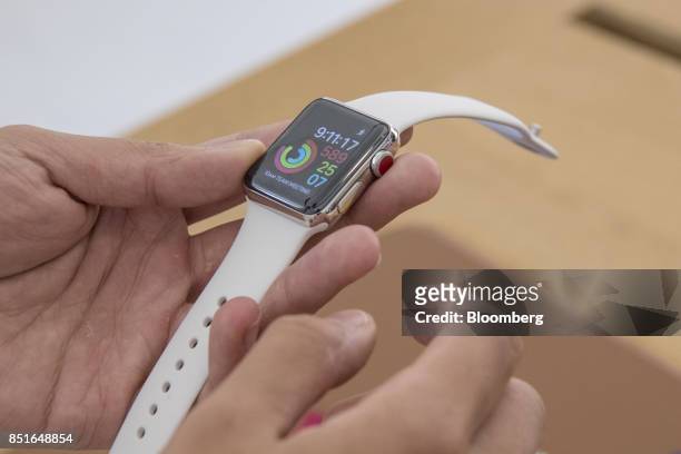 Customer views an Apple Inc. Watch series 3 device during the sales launch of the Apple Inc. IPhone 8 smartphone, Apple watch series 3 device, and...