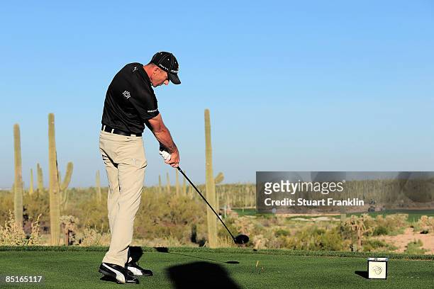 Geoff Ogilvy of Australia plays hits tee shot on the fifth hole during the final round of Accenture Match Play Championships at The Ritz-Carlton Golf...