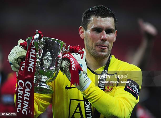 Goalkeeper Ben Foster of Manchester United celebrates with the trophy after victory during the Carling Cup Final match between Manchester United and...