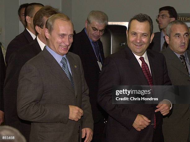 Russian President Vladimir Putin, left, walks with Prime Minister Ehud Barak of Israel at the United Nations during the U.N. Millennium Summit,...