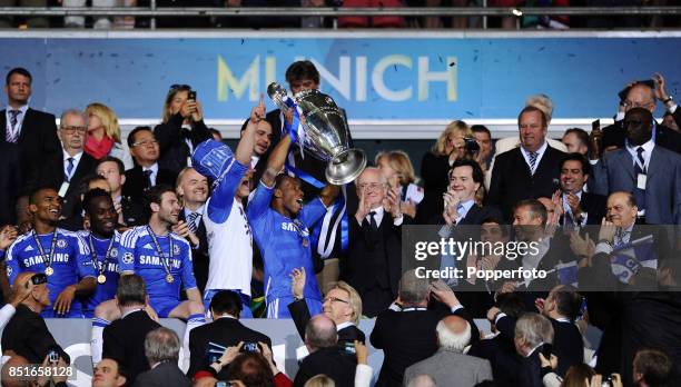 Didier Drogba of Chelsea hands the European Cup to club owner Roman Abramovich after they win the UEFA Champions League Final between FC Bayern...