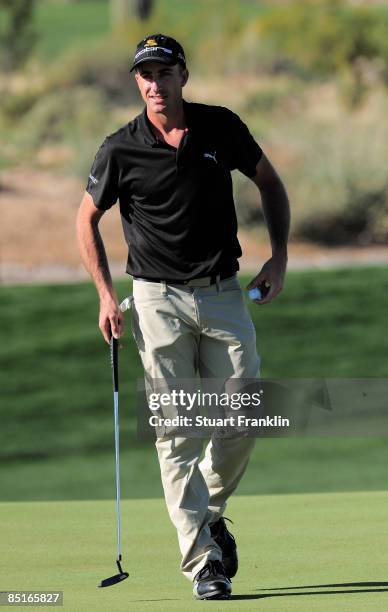 Geoff Ogilvy of Australia reacts after holing his putt on the eighth hole during the final round of Accenture Match Play Championships at The...