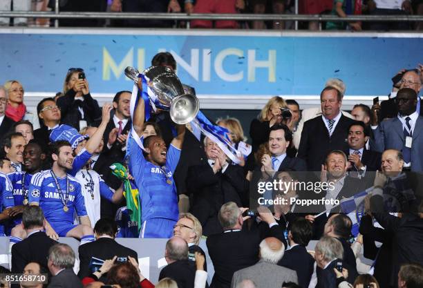 Didier Drogba of Chelsea hands the European Cup to club owner Roman Abramovich after they win the UEFA Champions League Final between FC Bayern...