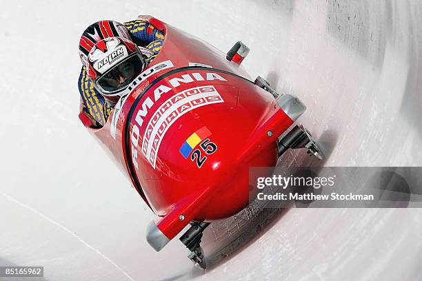 Romania 1, piloted by Nicolae Istrate, competes in the third run of the the four man competition during the FIBT Bobsled World Championships at the...