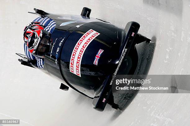 Great Britain 2, piloted by John James Jackson, competes in the third run of the the four man competition during the FIBT Bobsled World Championships...